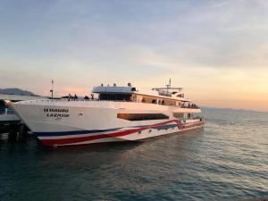a large boat sitting in the water at Coffeeisland in Nathon