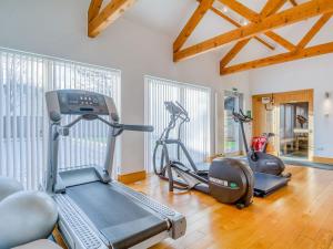 a gym with two exercise bikes in a room at Otters View in Somerford Keynes