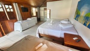 Postel nebo postele na pokoji v ubytování Brisa do Caitá Praia Hotel