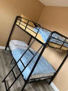 two bunk beds in a dorm room with a mattress and a mattress at #2 bedroom cozy SUITE, 1 min walk to the beach # in Bullhead City