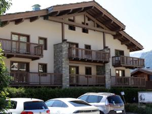 a large house with cars parked in front of it at Appartement Aussois, 4 pièces, 6 personnes - FR-1-508-279 in Aussois