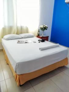 Cama o camas de una habitación en Hotel Isabella