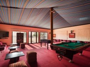 a billiard room with a pool table in it at Desert Nights Resort in Shāhiq