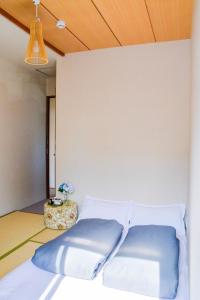 Postel nebo postele na pokoji v ubytování Guesthouse Hakuka