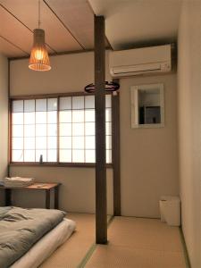 Postel nebo postele na pokoji v ubytování Guesthouse Hakuka