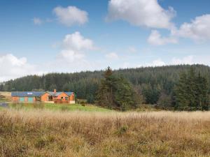 a house in the middle of a field at Mill Of Burncrook in Glenlivet