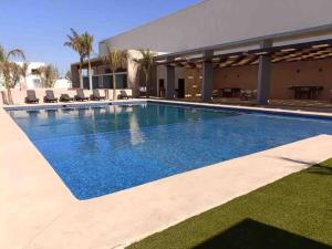a large swimming pool in front of a building at CASA YEYI in La Paz