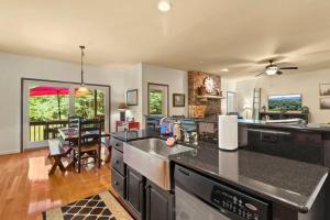 a kitchen with a sink and a counter top at Gorgeous Cottage with Hot Tub in Boone NC! in Boone