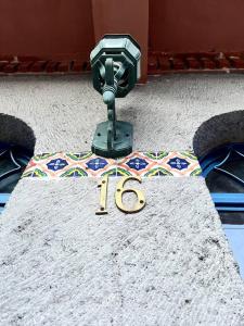 a table with a number on top of it at Olivos Habitación cuádruple in Tequisquiapan