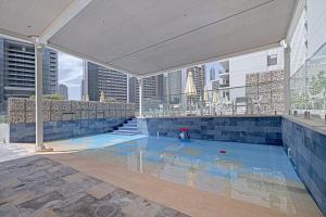 a swimming pool with a view of a city at Alluring 1 BD Apartment in Business Bay with Burj Khalifa view in Dubai