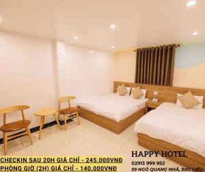 Postel nebo postele na pokoji v ubytování Happy Hotel