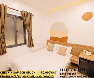 Postel nebo postele na pokoji v ubytování Happy Hotel