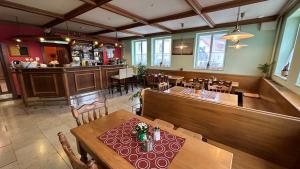 an overhead view of a restaurant with a table and chairs at Rožmberk Inn in Rožmberk nad Vltavou