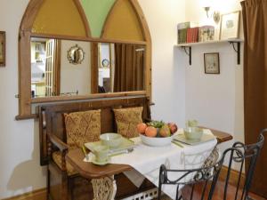 a dining room table with a bowl of fruit on it at 5 Church Square in Rigg