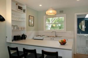 a kitchen with a bowl of fruit on a counter at Sahara Trails Cabin 3 WiFi Air Conditioning Horse Riding and much more in Anna Bay