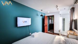 TV a/nebo společenská místnost v ubytování VNAHOMES Serviced Apartment