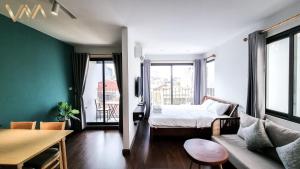 Postel nebo postele na pokoji v ubytování VNAHOMES Serviced Apartment