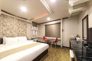 Postel nebo postele na pokoji v ubytování Opera Motel