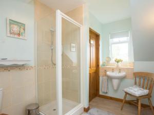 a bathroom with a shower and a sink at Hippos Rest in Mow Cop