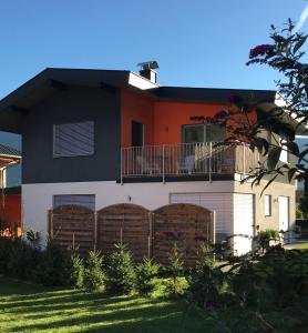 a house with a fence in front of it at Appartement Schusternagele in Amlach