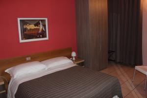 Postel nebo postele na pokoji v ubytování Hotel Pontenuovo