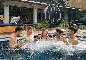 a group of people in a swimming pool at Fairways and Bluewater Boracay in Boracay