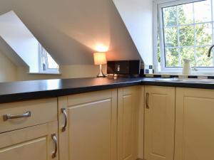 a kitchen with a counter top and a window at The Nest in York