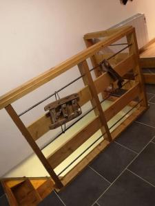 a wooden table with an old sewing machine on it at Coquet T1 hyper centre in Le Bourg-dʼOisans