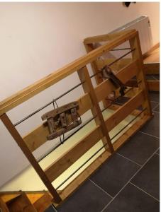 a wooden table with a sewing machine in a room at Coquet T1 hyper centre in Le Bourg-dʼOisans