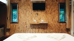 Postel nebo postele na pokoji v ubytování Nua Tone Resort Bang Tao & Cafe