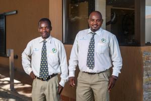 two men standing next to each other wearing ties at San Lameer Villa 3115 - 4 Bedroom Classic - 8 pax - San Lameer Rental Agency in Southbroom +35 photos