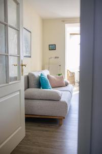 a living room with a couch with pillows on it at Villa Meeresblick in Sassnitz