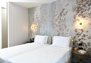 WestSide Residences by Rotana客房内的一张或多张床位