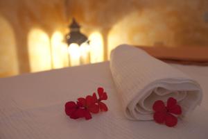 A bed or beds in a room at Hotel Villa Rita