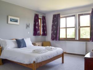 Postel nebo postele na pokoji v ubytování Battanropie Lodge