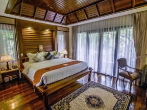 Letto o letti in una camera di Palace Residence & Villa Siem Reap