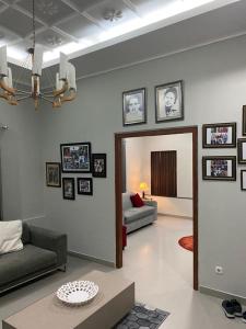 a living room with a couch and a table at Villa Syamsu in Bukittinggi