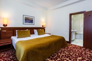 Postel nebo postele na pokoji v ubytování Hotel Violeta
