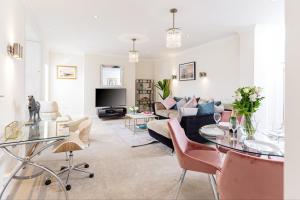 a living room with a couch and a table at 16 Lansdown -By Luxury Apartments in Cheltenham