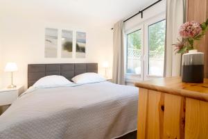 Postel nebo postele na pokoji v ubytování Bungalow Zwergenweg 2b