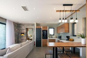 A kitchen or kitchenette at Seafront elegant villas, with infinity pools & devine views!