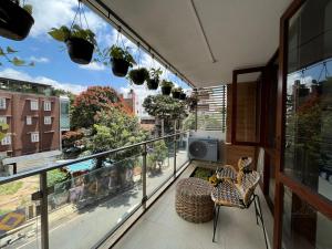 a balcony with a view of a city at LUHO Grande in Bangalore