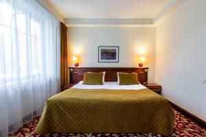 Postel nebo postele na pokoji v ubytování Hotel Violeta