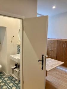 a bathroom with a toilet and a sink at wohnen auf dem Weingut - klein und fein in Maring-Noviand