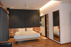 Postel nebo postele na pokoji v ubytování TGN SUITES - HOTEL