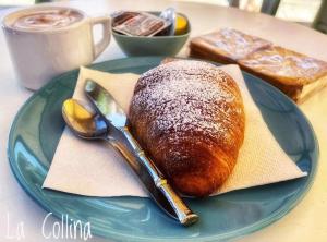 a blue plate with a loaf of bread on a table at Collina di Girgenti in Agrigento +53 photos