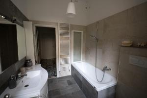a bathroom with a shower and a tub and a sink at Incantevole appartamento a Perugia in Perugia