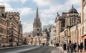 a city street with buildings and a cathedral at Cozy & Bright 2-Bedroom Apartment with Large Balcony and Free Parking in Oxford