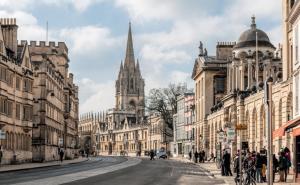 a city street with buildings and a cathedral at 5 Jarn Court. in Oxford