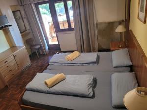 Postel nebo postele na pokoji v ubytování Appartements Pension Sonia